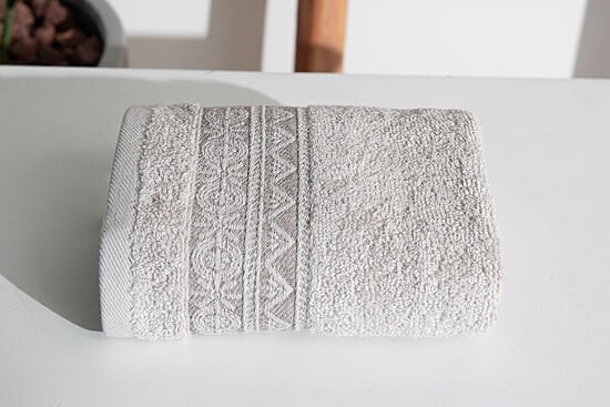 MOTIF PATTERN BORDERED TOWEL 30X50CM STONE